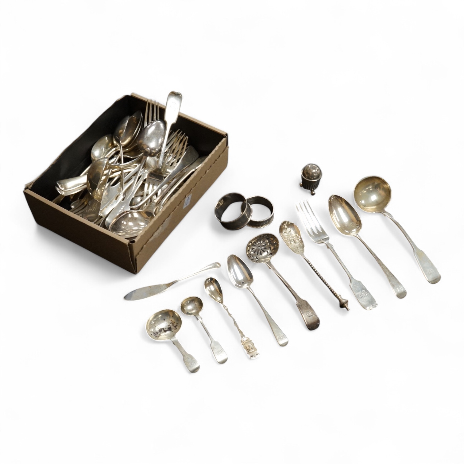 A quantity of assorted mainly 19th century flatware, various patterns, dates and makers including a set of six George III fiddle pattern table spoons by Eley, Fearn & Chawner, London, 1809, six silver fiddle pattern tabl